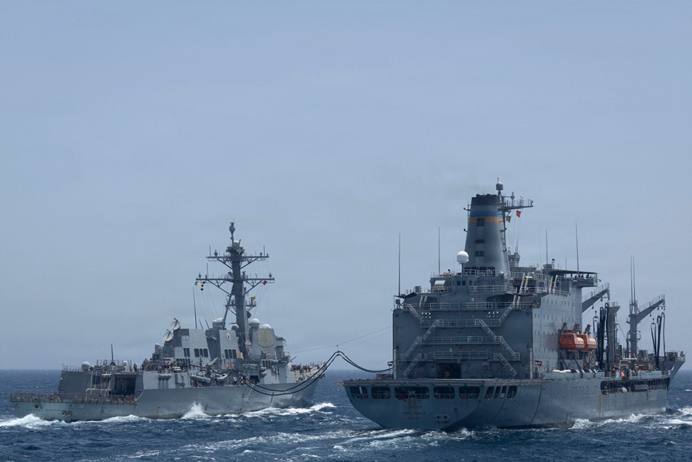 This US Navy handout photograph released on May 2, 2026 by US Central Command Public Affairs shows Arleigh Burke-class guided-missile USS Michael Murphy (DDG 112) conducting a replenishment-at-sea with fleet replenishment oiler USNS Henry J. Kaiser (T-AO-187) on April 27, 2026. (AFP)