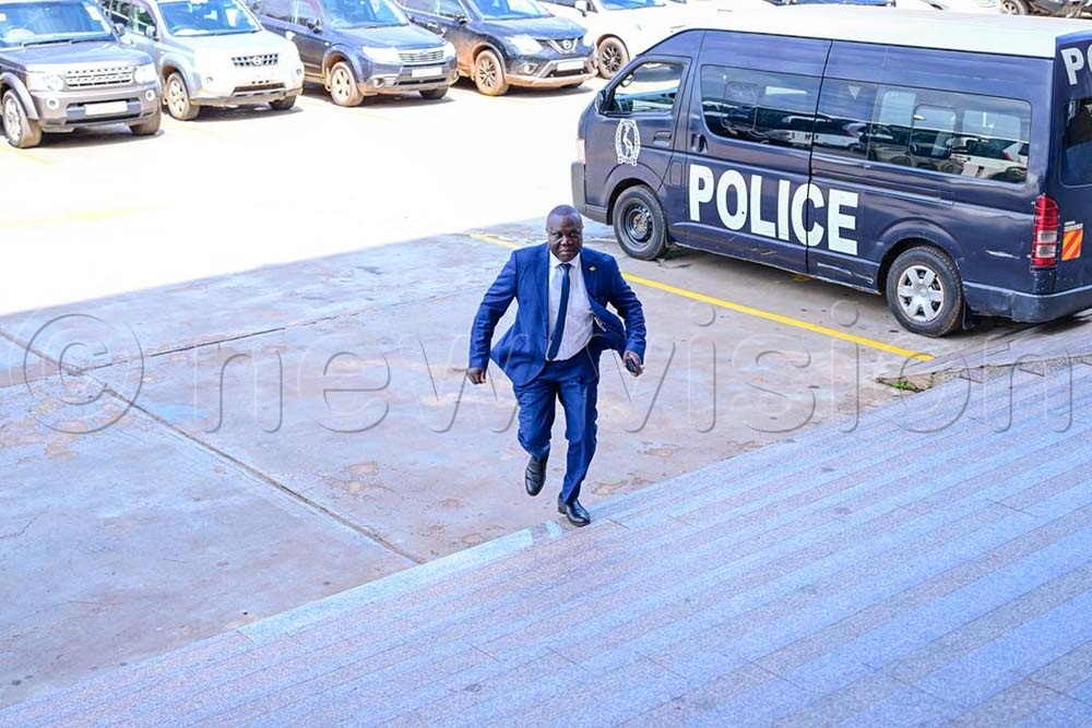 Among's lead counsel Caleb Alaka arrives at Parliament. (Credit: Miriam Namutebi)