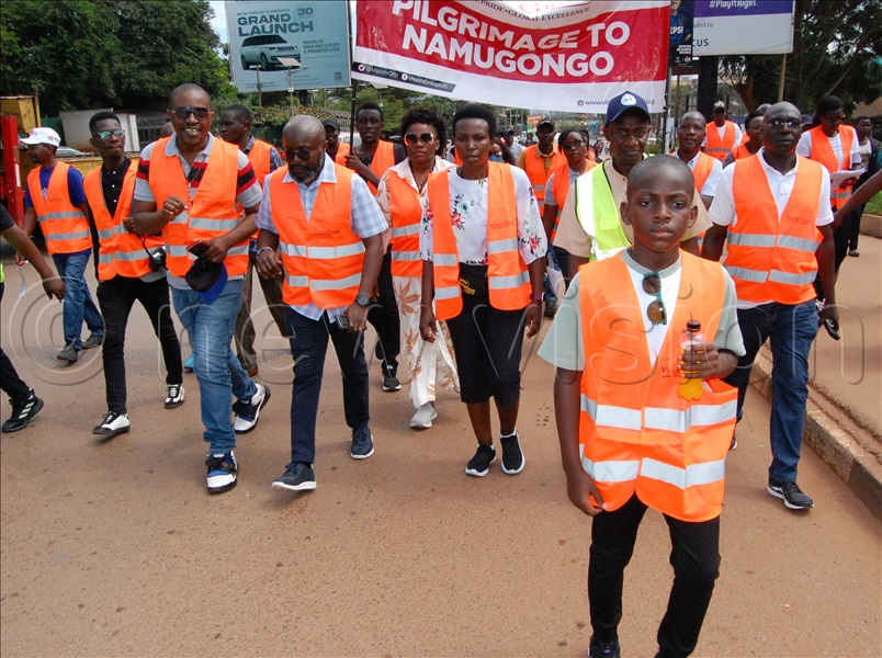 Ten-year-old Austin Wanyama (forefront) walking with Vision Group members of staff to Namugongo on Sunday, June 1, 2025.