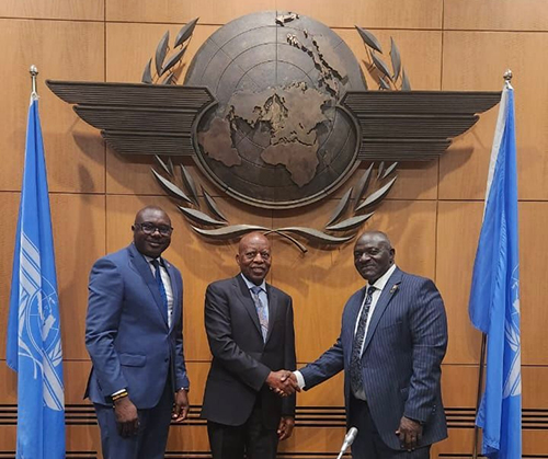 Hon. Katumba Wamala (right) congratulates Mr Kabbs Tijuke upon his designation as Uganda's Representative on the ICAO Council, looking on is Amb. Allan Kajik (left), Ag. High Commissioner of Uganda to Canada. (Courtesy)il Looking On L Is Amb. Allan Kajik Ag High Commissioner Of Uganda To Canada