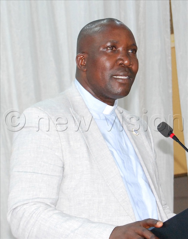 The Chairman of the Board of Governors of St. Mary's College Namagunga, Fr. John Lule delivers her speech during the school's fundraising dinner at Hotel Africana in Kampala on Thursday, December 4, 2025.