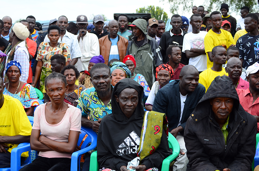 A section of the people who were displaced by the floods listened to the Prime Minister as she delivered the good news of resettlement. (Courtesy)