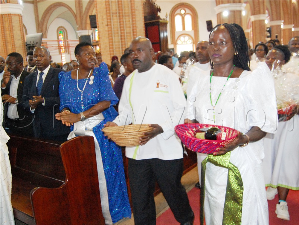 Catholic social communicators carrying offertory during mass.