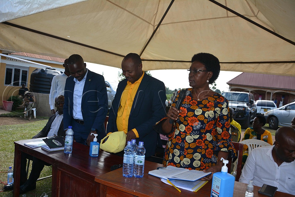 Kikuube RDC Godwine Agalia, left, NRM flagbearer Paddy Kisembo (centre) with Rosemary Nansubuga Sseninde, NRM&rsquo;S Director of Mobilization as she delivered her message. (Photo by Peter Abaanabasazi)