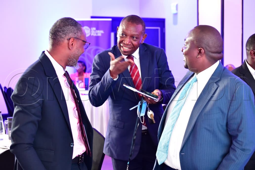 Delegates share a light moment at the launch