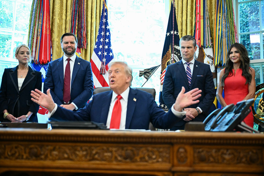 L-R, US Attorney General Pam Bondi, Vice President JD Vance, Defense Secretary Pete Hegseth and Secretary of Homeland Security Kristi Noem look on as US President Donald Trump speaks to the press before signing an executive order that aims to end cashless bail, in the Oval Office of the White House in Washington, DC on August 25, 2025. (AFP)