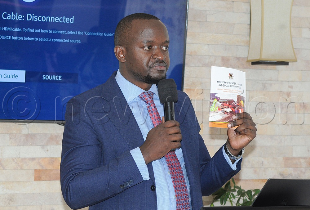 Hilary Businge, the assistant commissioner for labour productivity addressing participants during the orientation meeting. (Photo by Agnes Kyotalengerire)