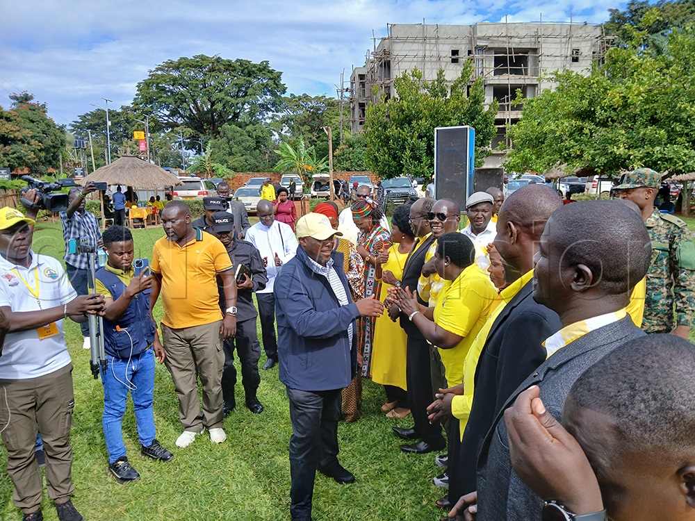Richard Todwong greeting NRM supporters on arrival. (Photo by Claude Omona)