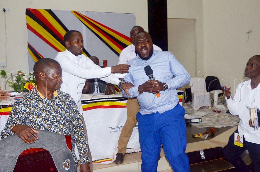 NUP's Najja Nasiifu speaks with frustration after grabbing the microphone from the returning officer of Wakiso district, Tolbert Musinguzi when he was going to declare Ian Kyeyune. (Photo by Job Nantakiika)