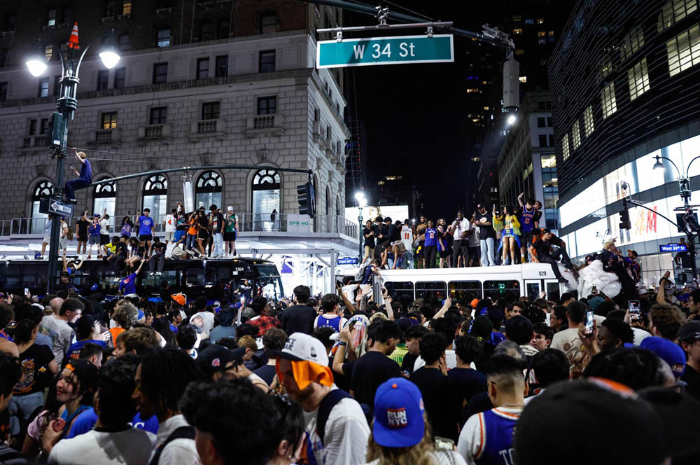 Knicks fans fill the street celebrating after the New York Knicks defeated the San Antonio Spurs in Game 5 of the NBA Finals to win the series, in New York, on June 14, 2026. (Credit: AFP)