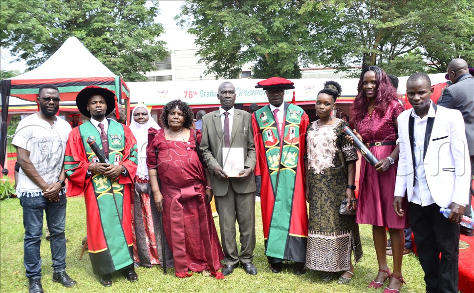 Derrick Kajjoba, Jeffy Semuddu with their family after receiving PHDs during the fourth day of the 76-graduation ceremony at Makerere University on February 27 2026. (Credit: Juliet Kasirye)