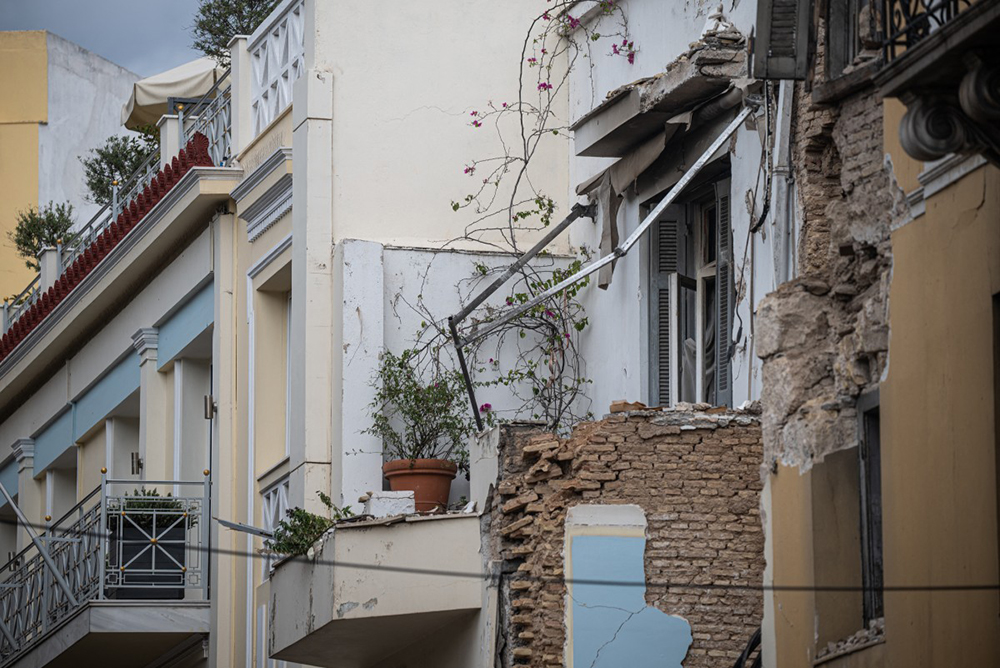 Debris are seen during a search and rescue operation after an old building partially collapsed following an explosion in the Plaka area of central Athens on September 26, 2026. (AFP)