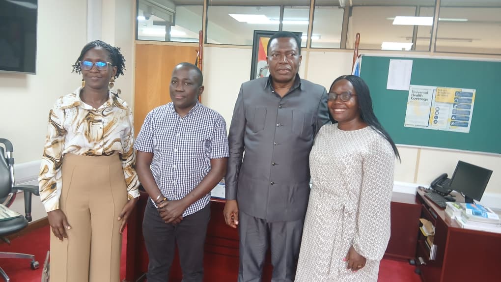 Byamukama posing for a photo with Dr Olaro (second-right), Mwesigwa (left) and another official.