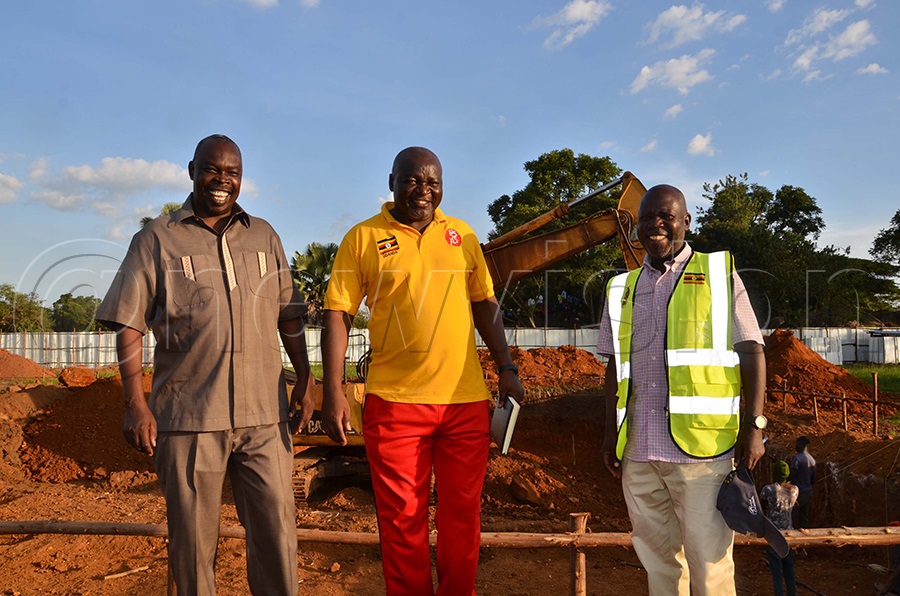 Rev canon Duncan Mugumuya,Commisioner Physical Education in the Ministry of Education and Sports,Julius Opaaso,the Headteacher and UPDF Engnier moving around the pool. Photo by Gabriel Esiku