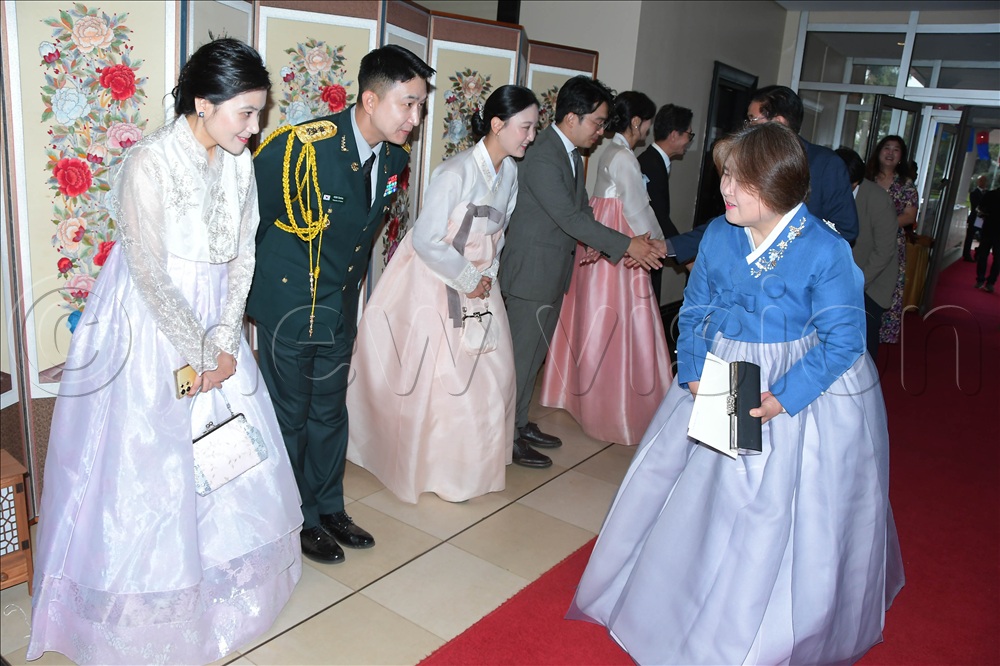 Korean embassy officials welcoming guests at their National Armed Forces Day.