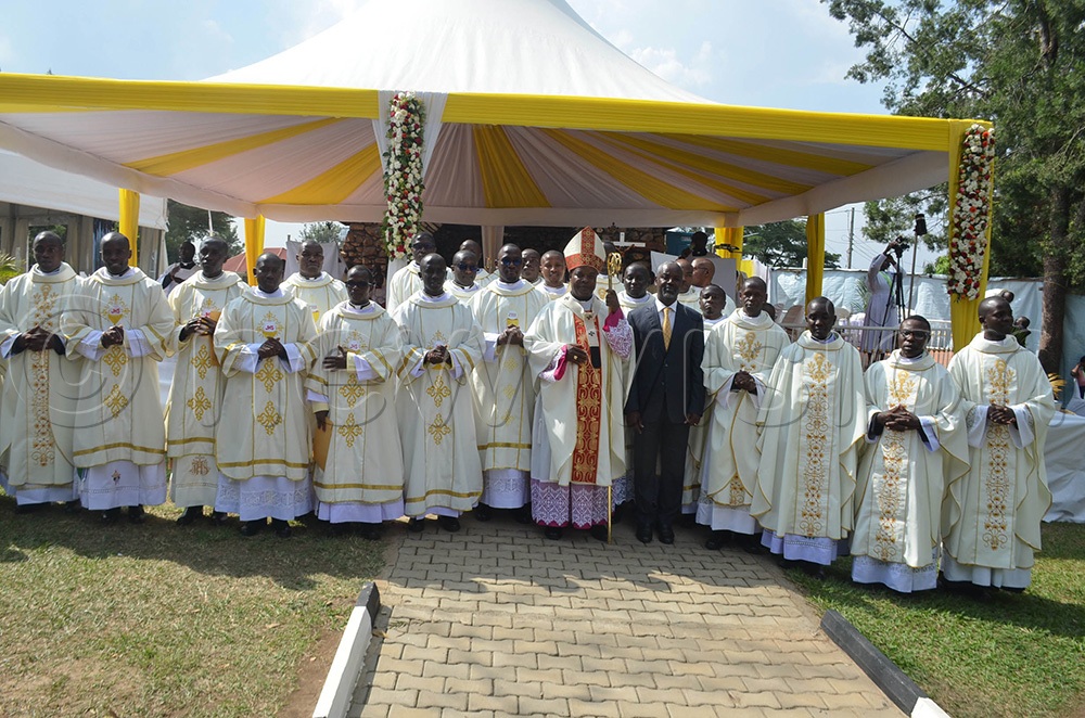 The Archbishop of Mbarara Archdiocese, His Grace Lambert Bainomugisha and Deputy Speaker of Parliament Thomas Tayebwa posing for the photo with the newly ordained priests and deacons shortly after the ordination ceremony on Saturday at Nyamitanga Cathedral in Mbarara city. (Photo by Abdulkarim Ssengendo)