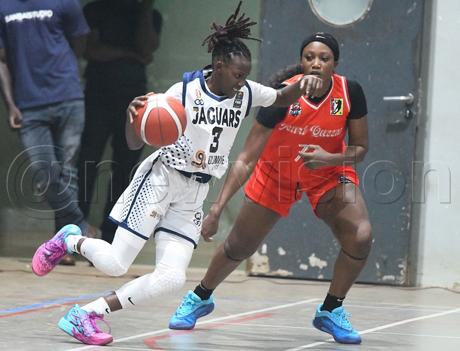 JT Jaguars Sandra Ayikoru (Left) takes on Pearl Queens Agatha Kamwada. Photo by Michael Nsubuga