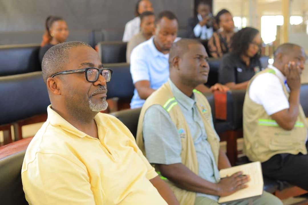 Br. Mouchili Mayoua (Yellow), Country Operations Manager, IsDB, and Br. Denis Okumu, Project Management Specialist on Agriculture Infrastructure attending an entry meeting at Bunyagabu District headquarters.