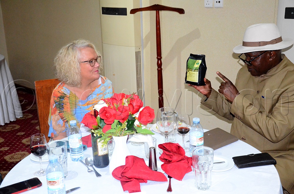 Umukuuka Jude Modoma gifting Jo Midgely, the deputy Vice-Chancellor of the University of the West England a pack of Elgon coffee. (Photo by Sam Wakhakha)