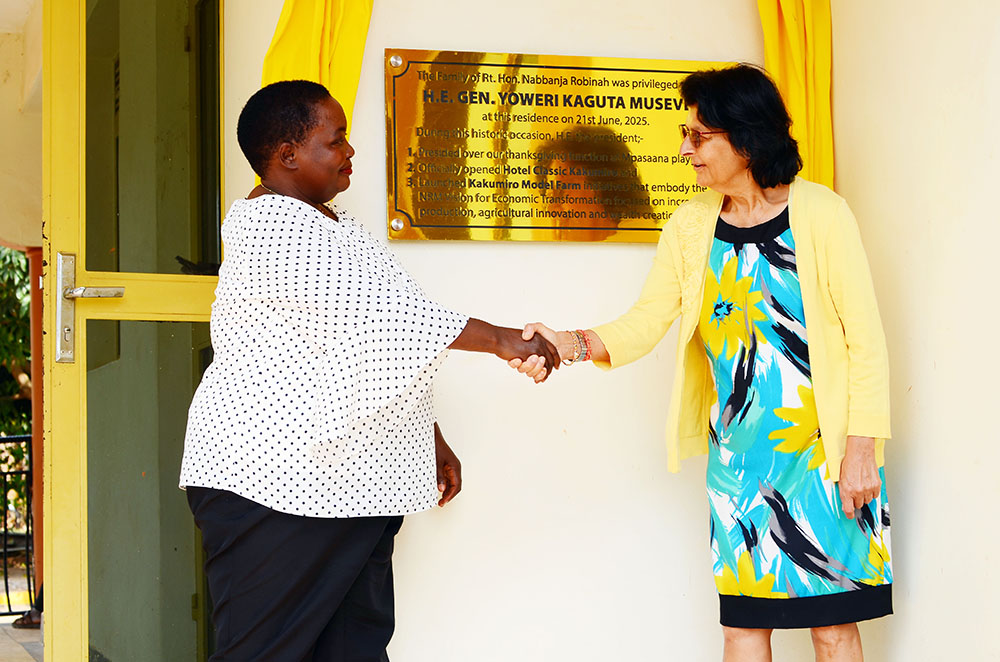 The Prime Minister Rt. Hon. Nabbanja Robinah shaking hands with Nimisha Madhivani, Uganda's High Commissioner to UK, at her country home in Kakumiro district. 