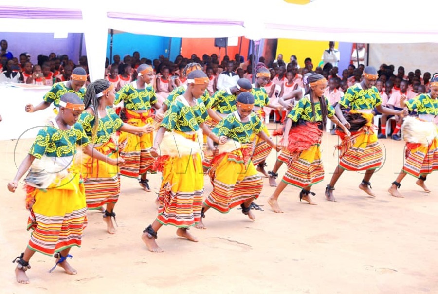 School children entertain the Bishop during his visit