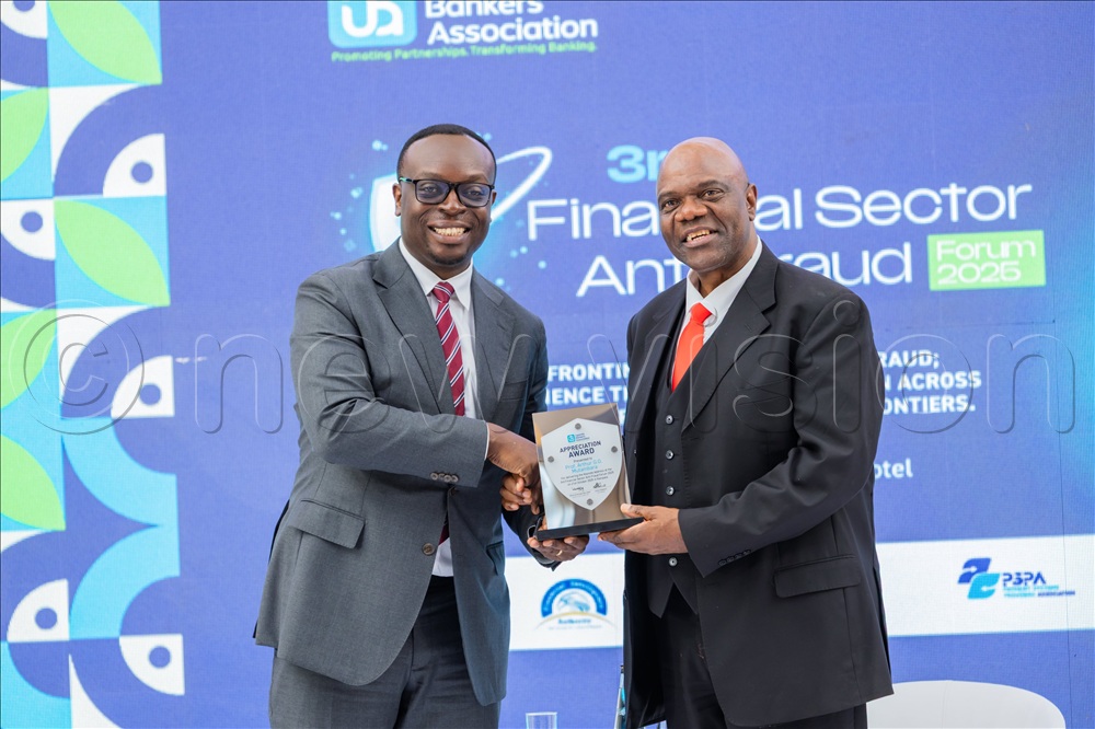 Julius Kakeeto, the UBA chairman (L) and Prof. Arthur Mutambara.