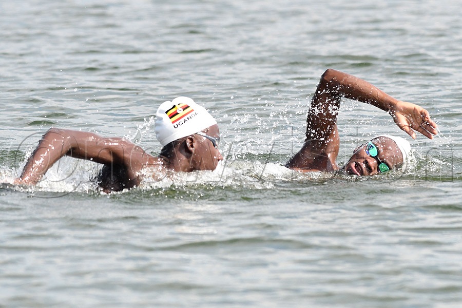 Arthur Mwase (left) and Benjamin Lutaaya compete in the 5km race during the first Open water championship at the Entebbe Sailing Club, October 10, 2026. Photo by Michael Nsubuga
