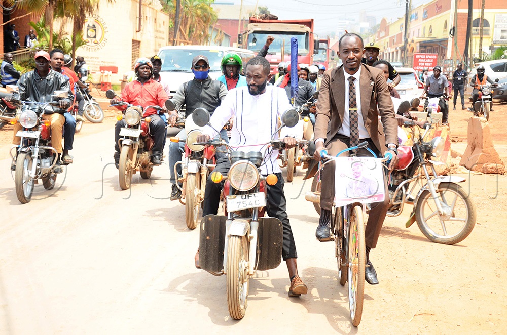 Independent candidate and lawyer Ronald Katushabe riding his bicycle from Ntinda to pick forms to express interest at the electoral commission. (Photo by Isaac Nuwagaba)