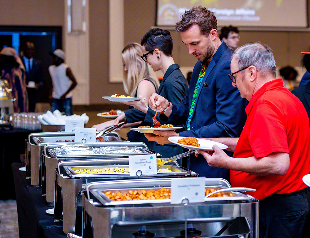 Guests in Canada being treated to Ugandan cuisines including a rolex