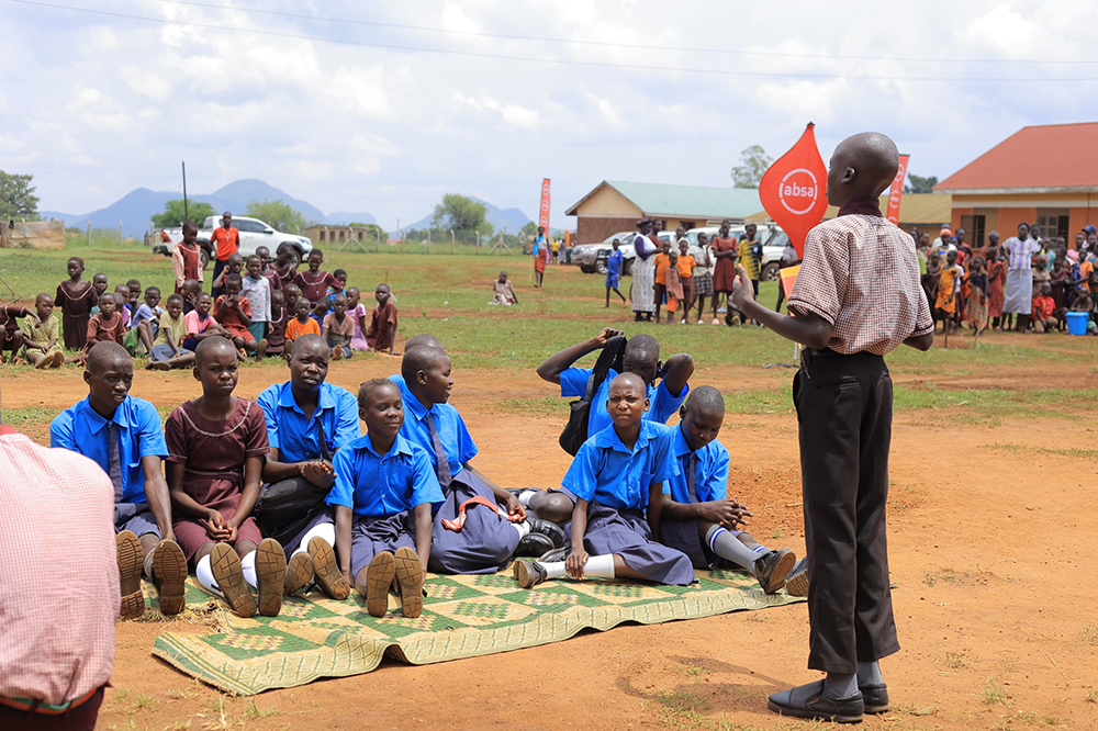 Pupils at Kanu Primary School perform a skit on breaking the stigma around Menstrual Hygiene