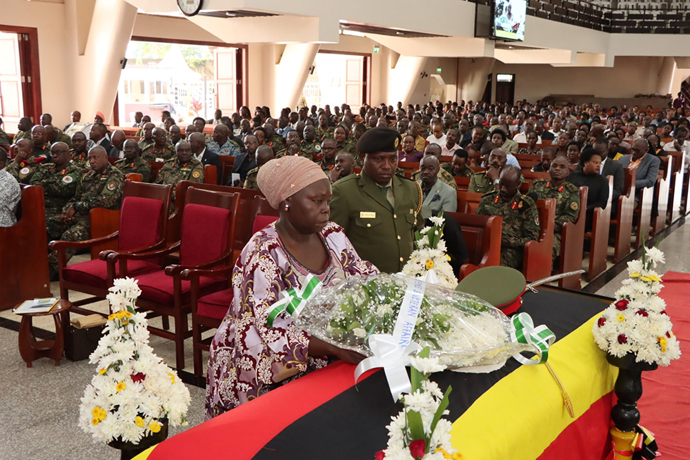 The Minister of State for Defence and Veteran Affairs, Huda Oleru Abason, lays a wreath on the casket of ate Maj. Gen. Takirwa during funeral service at All Saints Cathedral, Nakasero, on Feb. 11, 2026. (Courtesy)