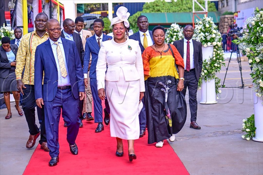 Among, in the company of her husband, Moses Magogo, arrived at the August House at about 9:00am in a modest private car, dressed in a cream dress complemented by a matching fascinator and a green corsage. (All Photos by Miriam Namutebi)