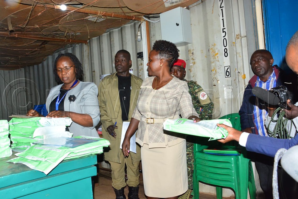 Head teachers from various schools in Kampala collecting Uganda Certificate of Education (UCE) examination papers from the Jinja Road Police Distribution Centre. (Credit: Edward Luyimbazi)