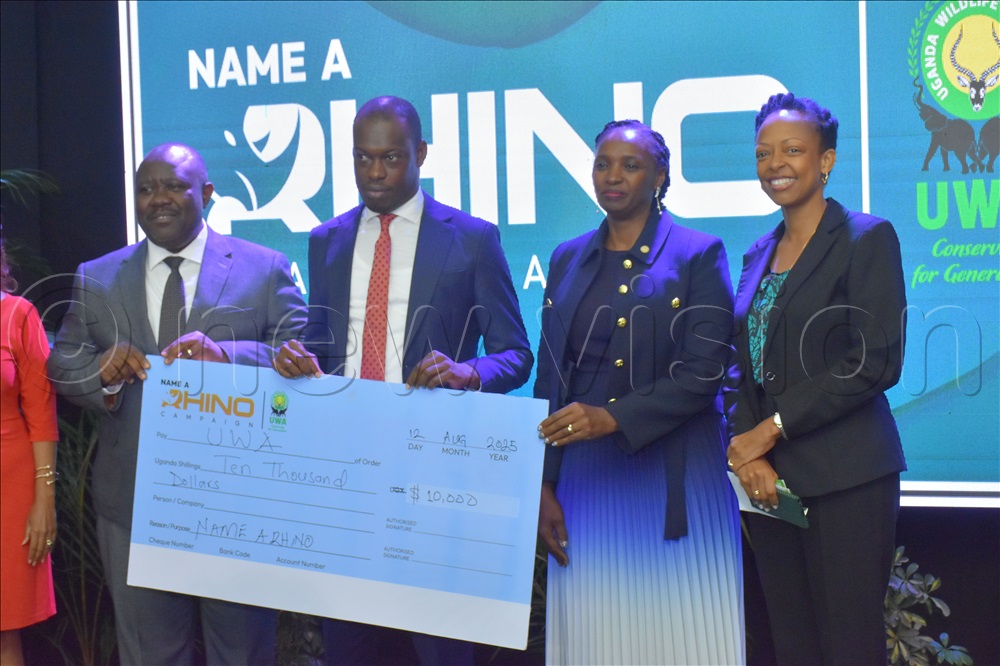 Minister of State for Tourism Martin Mugara and the ED UWA James Musinguzi during the launch of the Rhino baby naming exercise at the Sheraton Hotel. (Photo by Julius Luwemba)