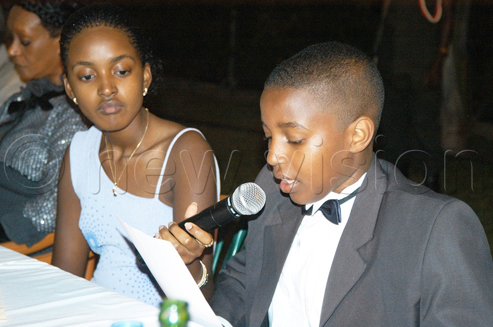 His Highness Omukama Oyo addressing his subjects at the 9th Anniversary of Tooro Kingdom Royal Annual Dinner which was sponsored by Celtel at Speke Resort Munyonyo on 8th September, 2004. Looking on is his sister Princess Komuntale (L). (New Vision Archives)
