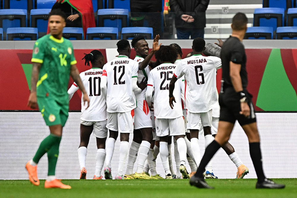 Sudan's players celebrate their team's first goal during the Africa Cup of Nations (CAN) round of 16 football match between Senegal and Sudan at Grand Stadium in Tangiers on January 3, 2026. (Photo by Gabriel BOUYS / AFP)