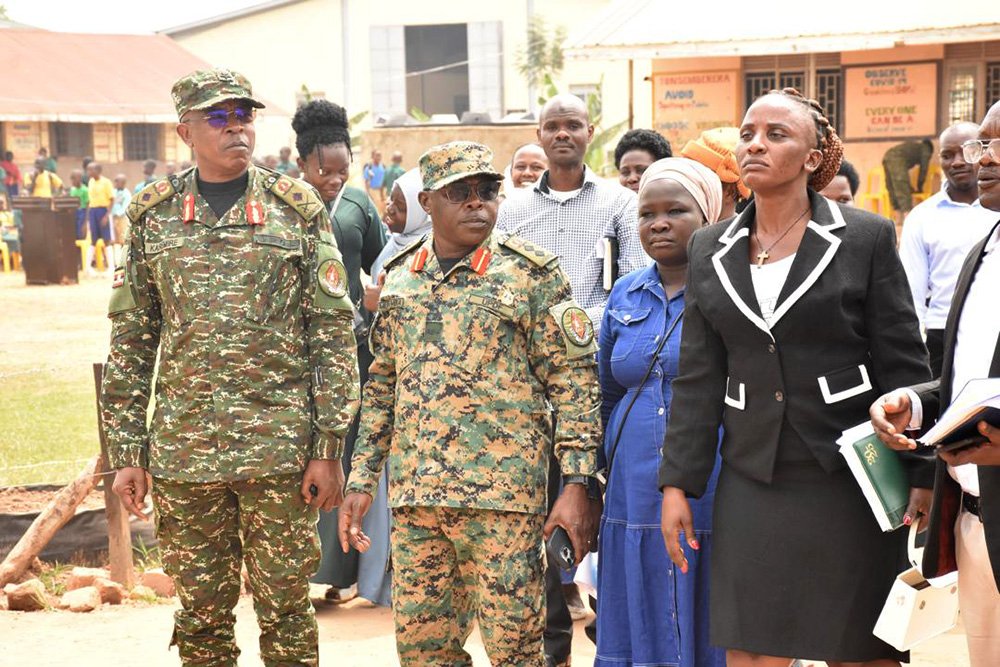 The Joint Staff Formal Education, Sports and Culture, Brig Gen Richard Karemire and CDF’s Military Assistant, Col Christopher Muwumba inspecting Bombo Barracks Nursery and Primary School complex. (Credit: UPDF)