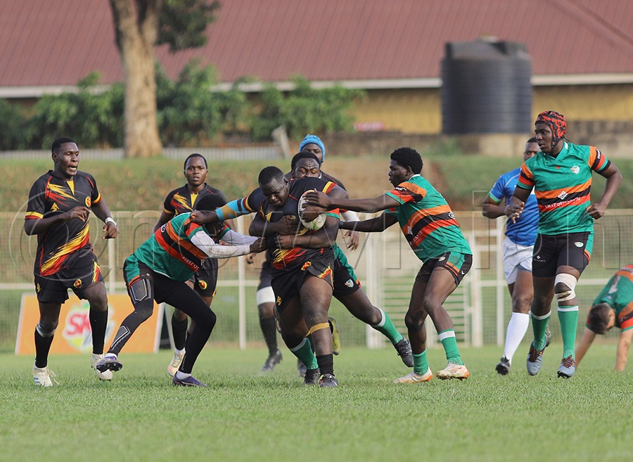 Uganda's Sylvester Mungu-Acel takes on Zambian opponents during the Barthes Cup at Wankulukuku Stadium