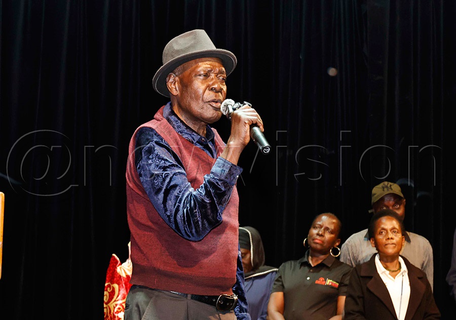 Christopher Mukiibi speaks to mourners at the National Theatre during Alex Mukulu's farewell tribute. Photo by Ignatius Kamya