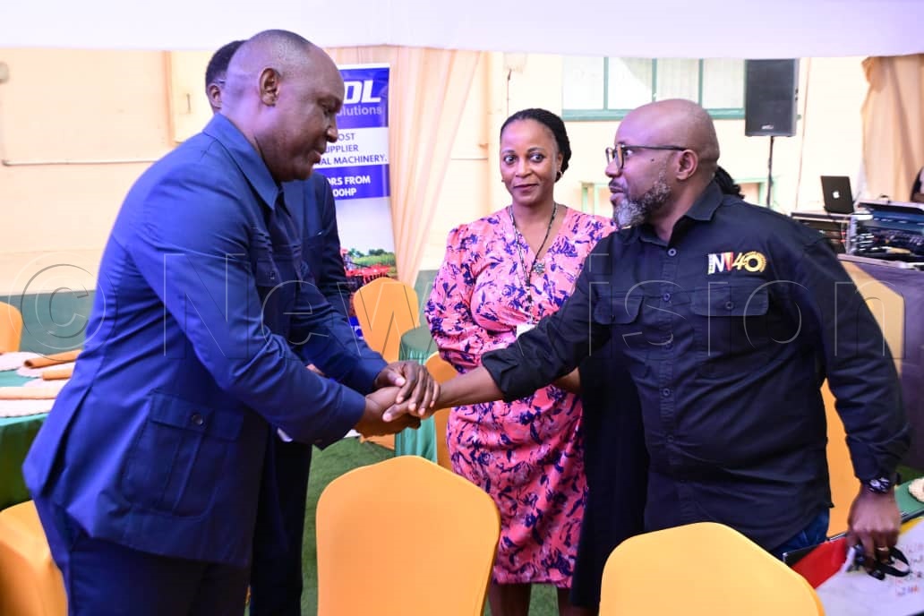 Vision Group CEO, Don Wanyama, greeting Med Mwiri from ENGSOL.