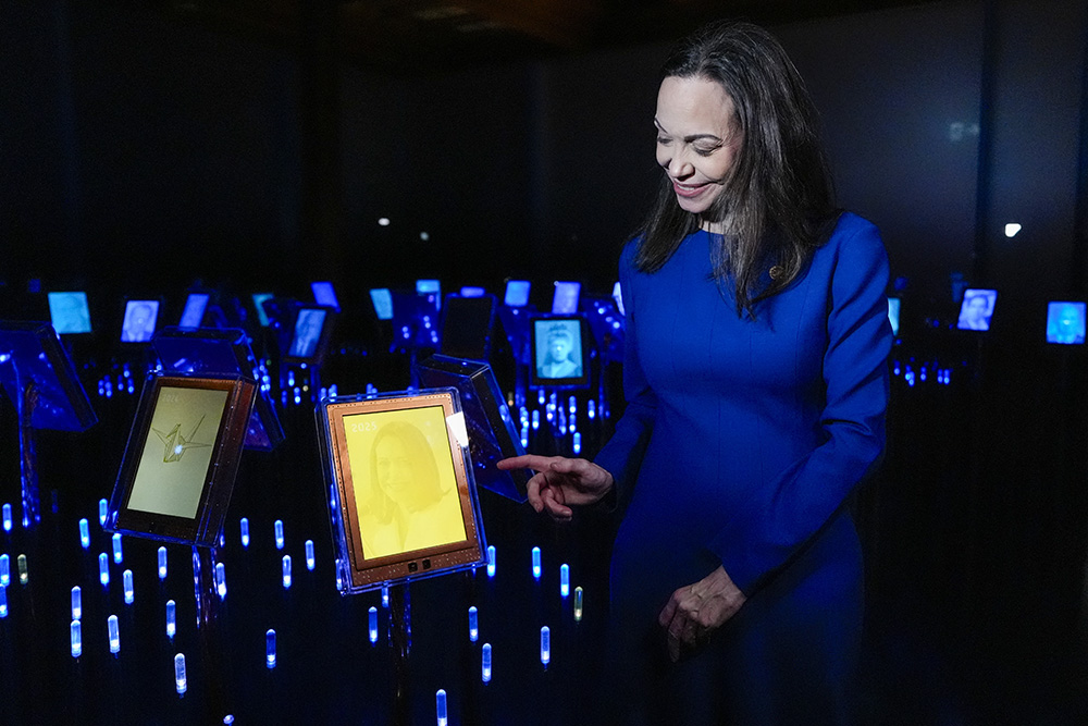 Nobel Peace Prize laureate Maria Corina Machado shows her picture on display during the opening of the official Peace Prize exhibition at the Nobel Peace Center in Oslo, Norway, on December 11, 2025. (Photo by Lise Åserud / AFP)