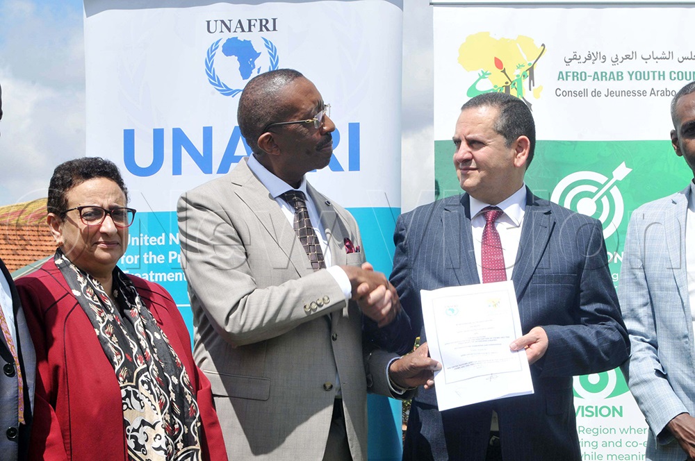 (L-R) Amina Hilmi the Deputy Secretary General of the Afro-Arab Youth Council, Andrew Karokora the Deputy Director General United Nations African Institute for the Prevention of Crime and Treatment of Offenders (UNAFRI) and Abdulhadi Lahweej the President of the Afro- Arab Youth Council during the signing of MOU in areas of Cooperation in peace, unity and development for the African and Arab Youths on April 8, 2026. (Photo by Nicholas Oneal)
