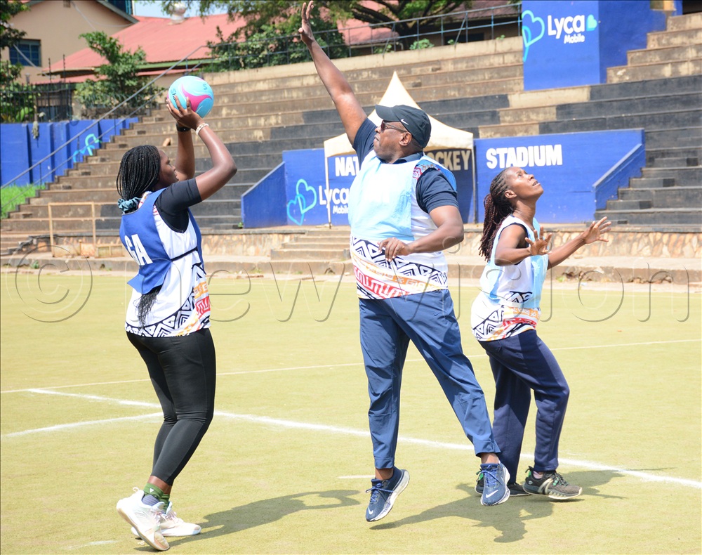Commonwealth Sport president Donald Rukare (center) tries to block a shot during the team's training at Lugogo, June 28, 2026.