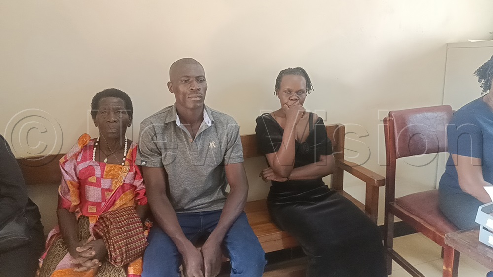 Alice Mbolanyi in court along side her late husband's family. (Credit: Eric Yiga)