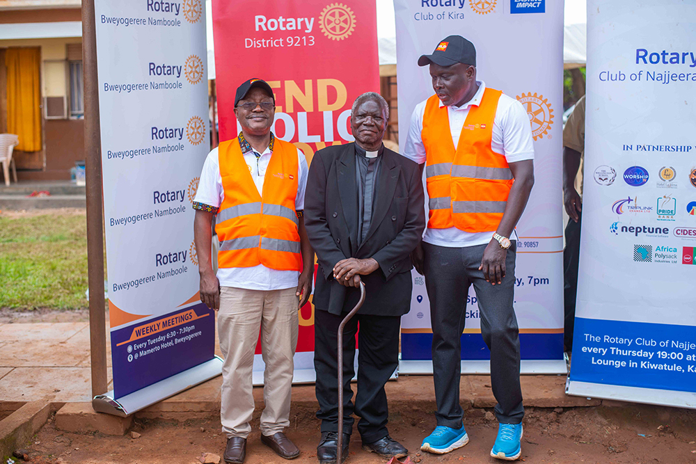 Rev. Okello (centre) with Rotary District 9213 Governor Gerald Obai (right) and past District Governor Mike Ssebalu (left). (Courtesy)