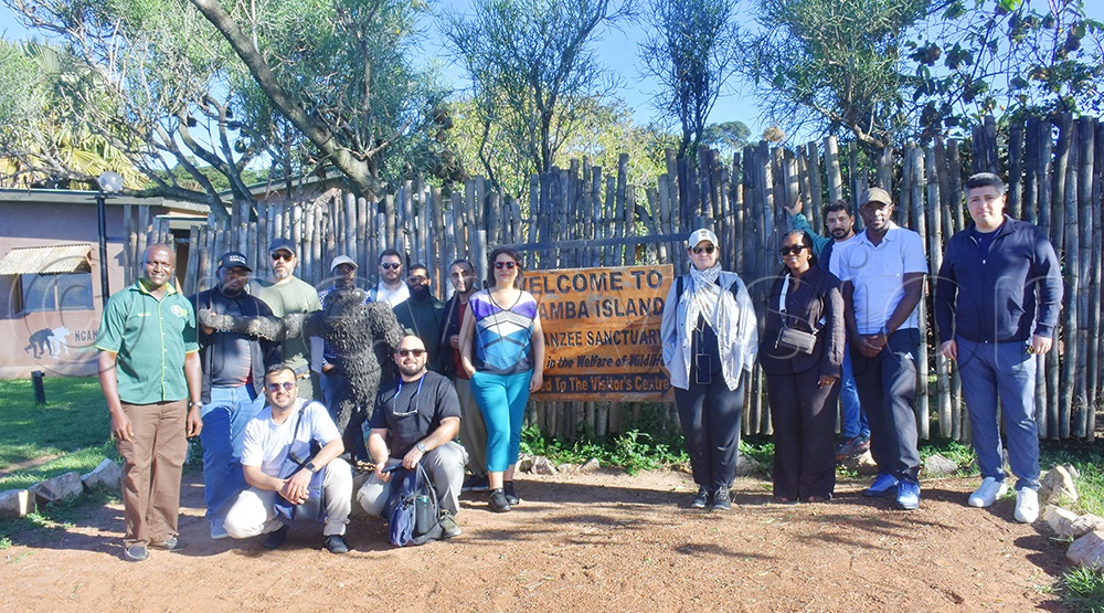 T&uuml;rkiye tour operators and officials from UTB and the Ugandan Embassy in  T&uuml;rkiye pose for a photo during their visit to Ngamba chimpanzee island. (Photo by Julius Luwemba)