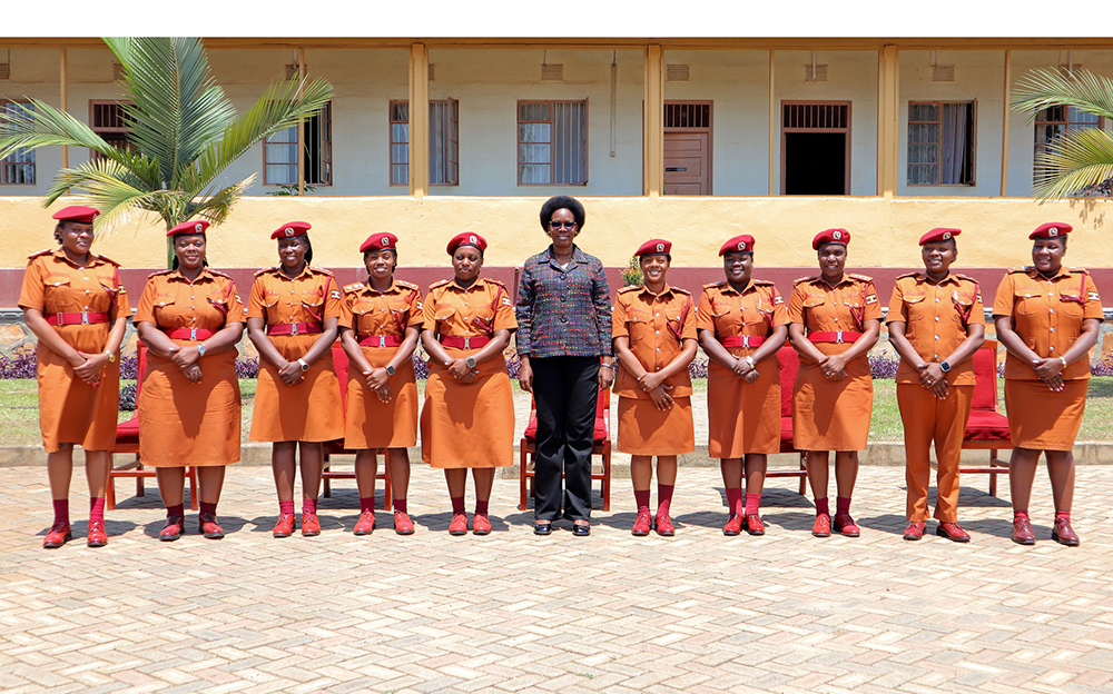 Deputy Inspector General of Government (IGG), Dr Patricia Achan Okiria poses for photo with senior cadet Prisons officers at the Prisons Training School in Luzira, Kampala. (Courtesy photo)