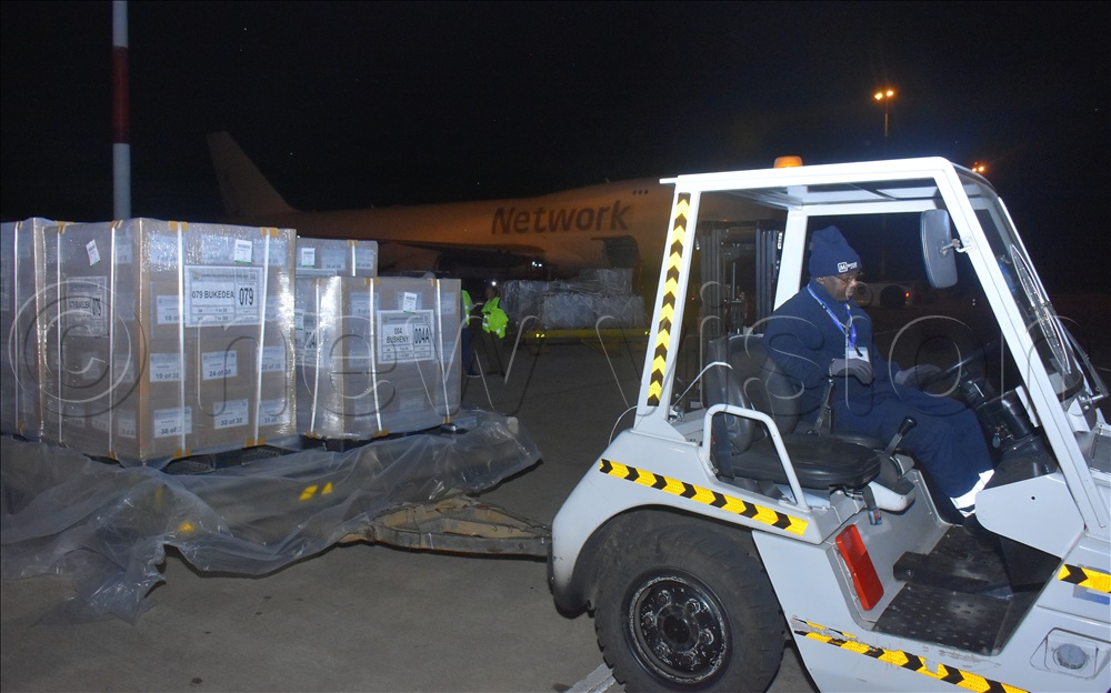 A folk lift pulling pallets of the presidential ballot papers from the aeroplane to the waiting truck to be transported to the EC warehouse.