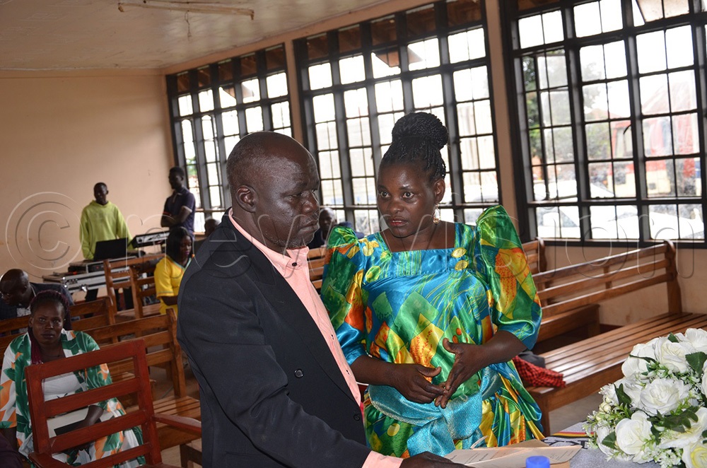 Kenneth Muwanika and wife looking puzzled in the nomination hall upon realizing that his symbol had been allocated to another candidate. (Photo by Jackie Nambogga)