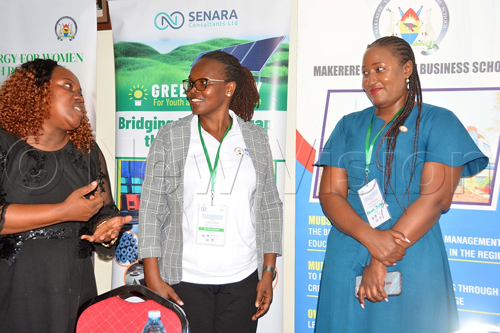 Dr Sylvia Aarakit (centre) the project principal investigator at Makerere University Business School, interacts with Joy Florence Kyozaire (left) the chief executive officer Sendea and Solar Giant Compnay and Justine Akumu the senior clean cooking officer at the Energy Ministry after the opening of the green energy for women and youth workshop at Nakawa Vocational Training College in Kampala on March 30, 2026. (Photo by Francis Emorut)
